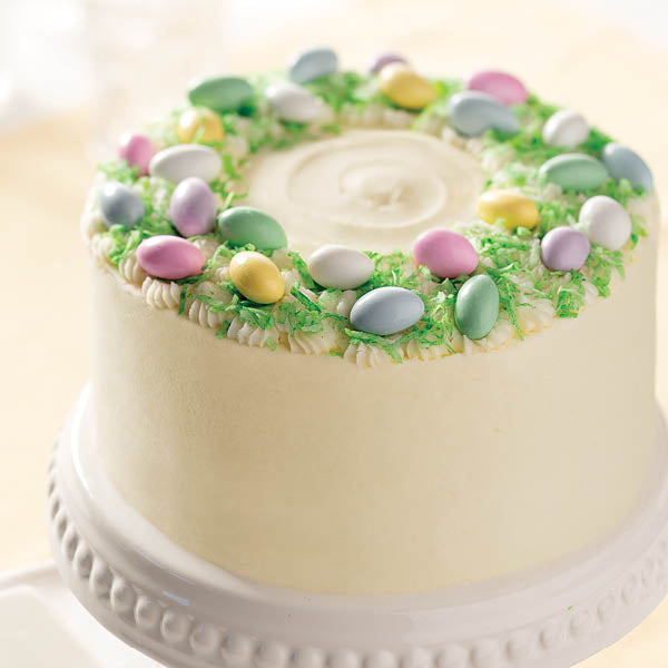 Festive Vanilla Buttercream Cake with coconut "grass" and sugared Jordan almonds