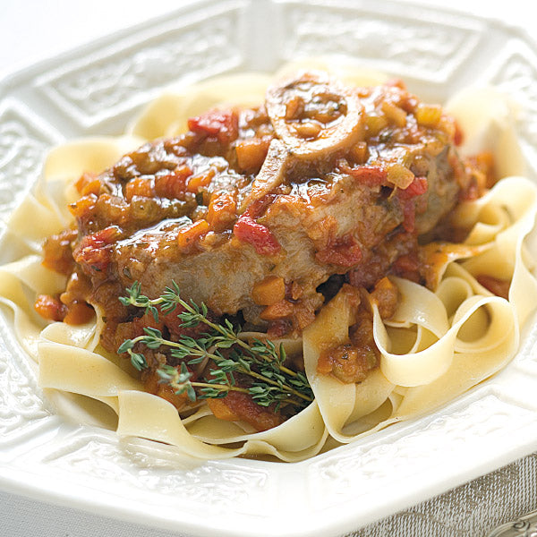 Gourmet veal osso buco plated with pasta